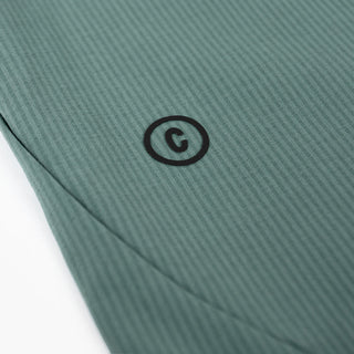 detail view of the printed C logo of the ciele athletics CCPants unisex running pants from the Lifestyle Edition collection, in silver pine color