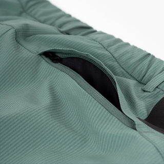 detail view of the back zippered pocket of the ciele athletics CCPants unisex running pants from the Lifestyle Edition collection, in silver pine color