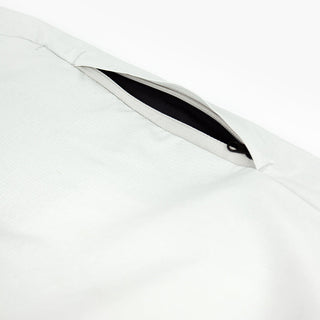 detail view of the leg zippered pocket of the ciele athletics CCPants unisex running pants from the Lifestyle Edition collection, in light grey color