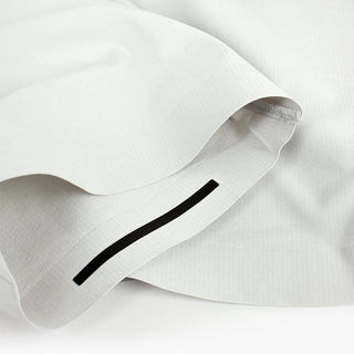 detail view of the leg insert of the ciele athletics CCPants unisex running pants from the Lifestyle Edition collection, in light grey color