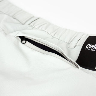 detail view of the zippered back pocket of the ciele athletics CCPants unisex running pants from the Lifestyle Edition collection, in light grey color