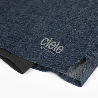 detail view of the printed ciele logo of the ciele athletics WRKShort unisex running and technical short from the Lifestyle Edition collection, in denim indigo color