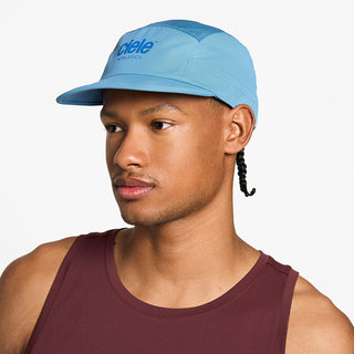 side view of the ciele athletics GOCap unisex running hat in dusty blue color, on a model