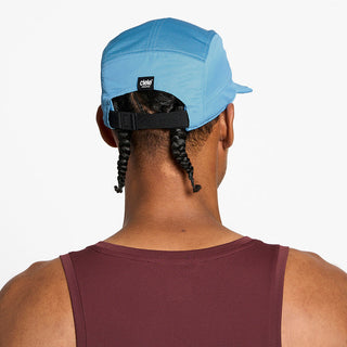back view of the ciele athletics GOCap unisex running hat in dusty blue color, on a model