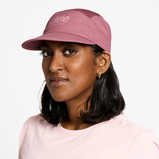 side view of the ciele athletics GOCap unisex running hat in deco rose color, on a model