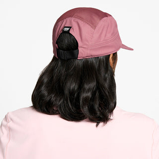 back view of the ciele athletics GOCap unisex running hat in deco rose color, on a model