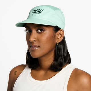 side view of the ciele athletics GOCap unisex running hat in dusty turquoise color, on a model