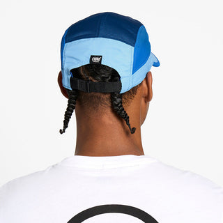 back view of the ciele athletics GOCap unisex running hat with a curved brim in dusty blue color, on a model