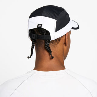 back view of the ciele athletics GOCap unisex running hat with a curved brim in trooper color, on a model
