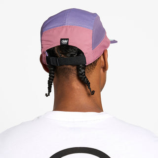 back view of the ciele athletics GOCap unisex running hat in deco rose color, on a model