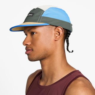 side view of the ciele athletics GOCap unisex running hat in seaweed color, on a model