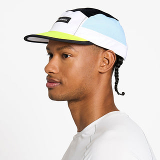 side view of the ciele athletics GOCap unisex running hat in black and white color, on a model