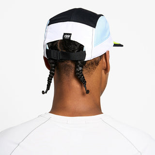 back view of the ciele athletics GOCap unisex running hat in black and white color, on a model