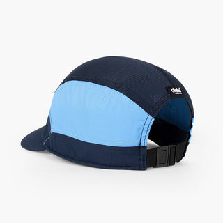 back view of the ciele athletics FTSCap unisex running hat with a curved brim in indigo color