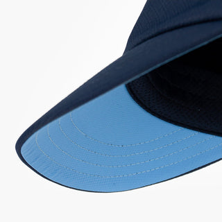 underbrim view of the ciele athletics FSTCap unisex running hat with a curved brim in indigo color