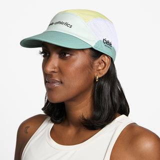 side view of ciele athletics GOCap SC Field Loopy unisex running hat in dusty turquoise color on a model