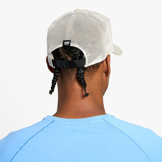 back view of the ciele athletics TRLCap unisex running hat with a curved brim in rainy day color, on a model