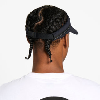 back view of the ciele athletics TRLCap unisex running visor with a curved brim in black color, on a model