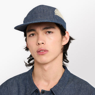 front view of ciele athletics GOCap longbrim unisex running hat with longer brim from the Lifestyle Edition collection, in denim indigo color, on a model