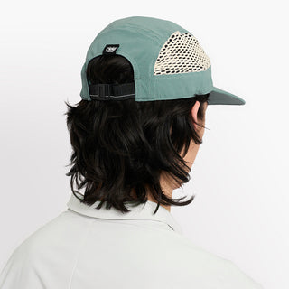 back view of ciele athletics GOCap longbrim unisex running hat with longer brim from the Lifestyle Edition collection, in silver pine color, on a model