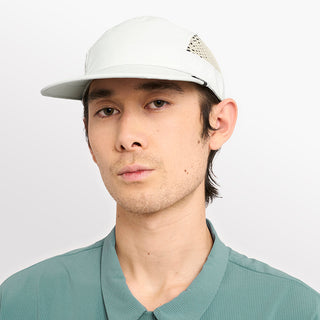 front view of ciele athletics GOCap longbrim unisex running hat with longer brim from the Lifestyle Edition collection, in light grey color, on a model