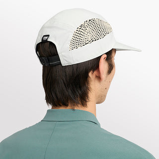 back view of ciele athletics GOCap longbrim unisex running hat with longer brim from the Lifestyle Edition collection, in light grey color, on a model